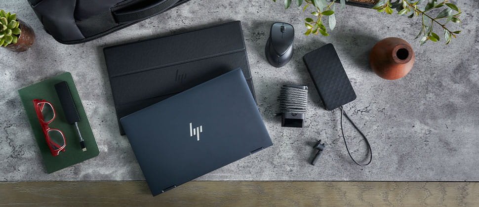 HP Laptop, charger, mouse and a diary